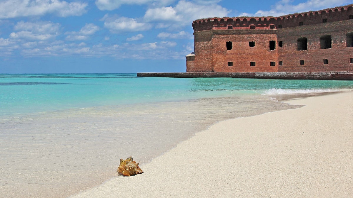Fort Jefferson at Dry Tortugas National Park surrounded by crystal-clear turquoise waters — the most remote national park in the continental United States
